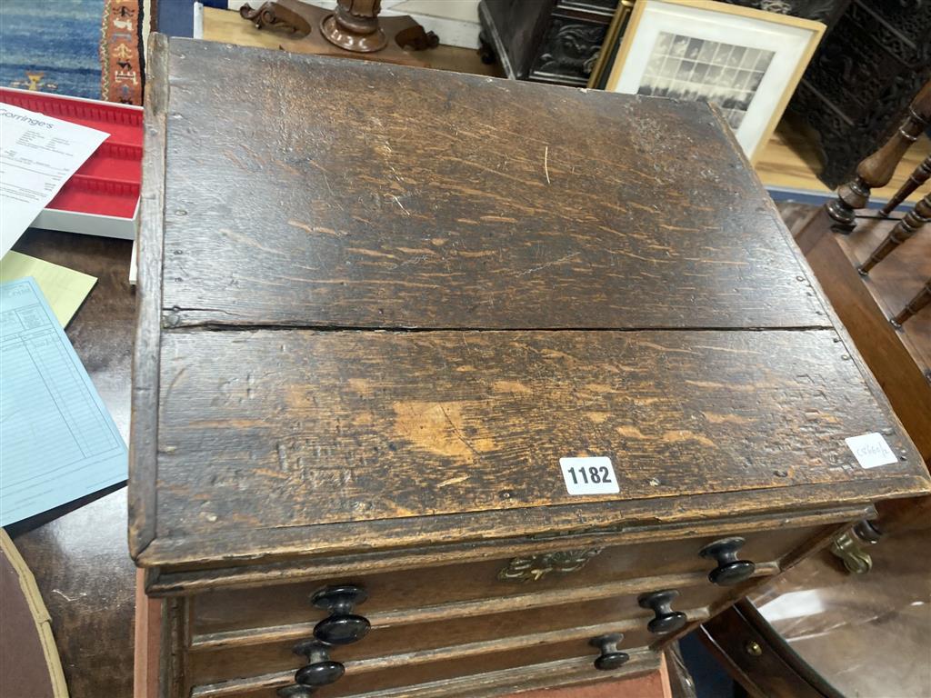 A Queen Anne oak commode, with dummy drawer front, width 46cm, depth 39cm, height 43cm